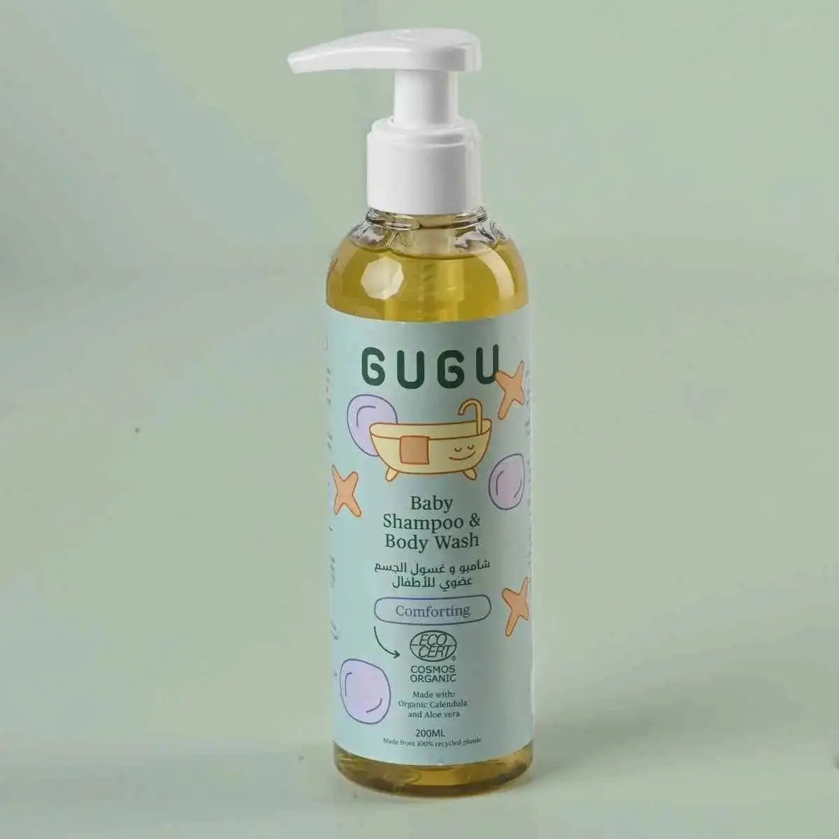 Bottle of GUGU baby shampoo and body wash on a light green background