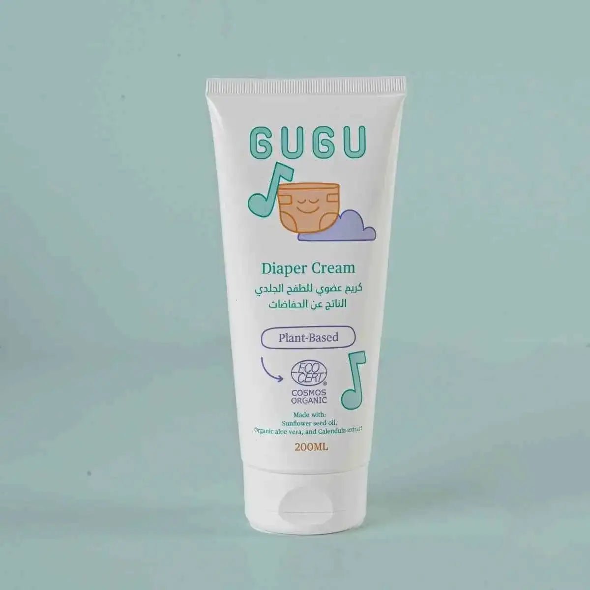 GUGU diaper cream tube on a light green background
