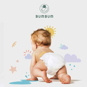 Baby wearing a diaper with Bumbum logo and branding elements on a light background