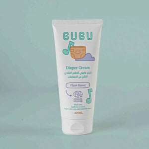 GUGU diaper cream tube on a light green background